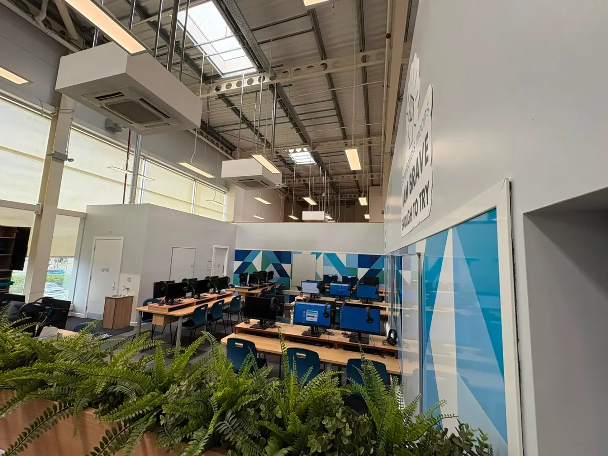 Commercial IT suite fit-out with suspended services, acoustic baffles and new furniture