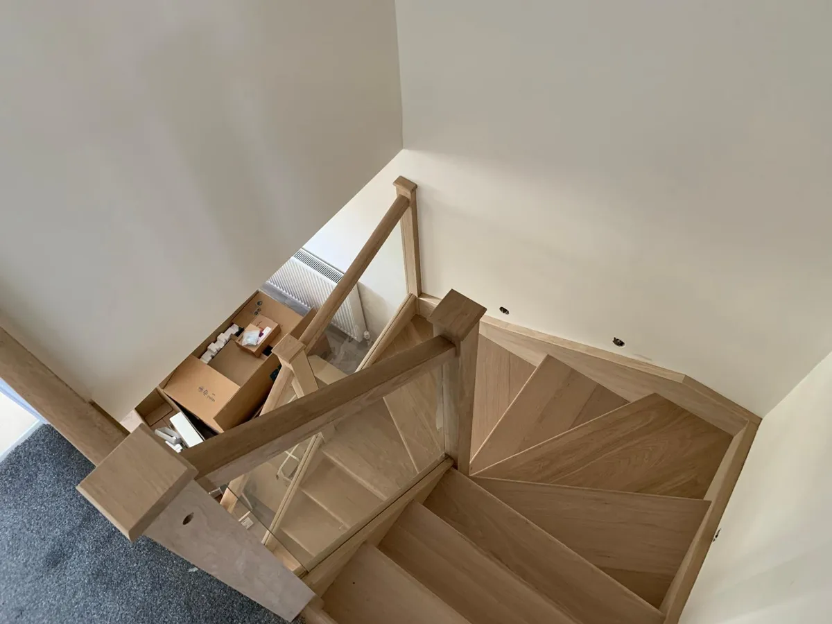 Renovated staircase with painted strings, oak treads and steel spindles